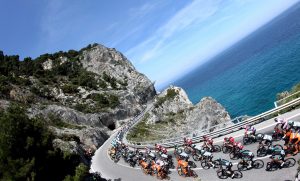 Cyclists compete during the second stage of the Giro d'Italia, Tour of Italy cycling race from Albenga to Genoa, Italy, Sunday, May 10, 2015. Elia Viviani timed his sprint to perfection to win the second stage of the Giro d'Italia Sunday, while Michael Matthews moved into the overall lead on a day dominated by crashes. (Claudio Peri/ANSA via AP)